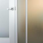Lever-handled hardware is used on the hinged door.  Door hardware can be specified to match the customer's choice.