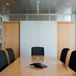 Custom millwork is incorporated in the office dividing wall.
