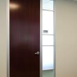 A sidelite used at a door opening allows natural lighting from the building perimeter into the space.